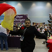 Lady Crowley cosplay and her silk flame colored fans