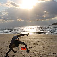 freestyle frisbee at a beach party