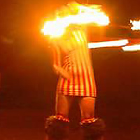 Fire Spinning On Stilts