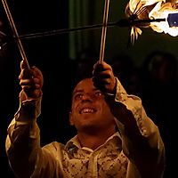 kid meets fire. kid smiles.