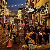 Staff toss under lights
